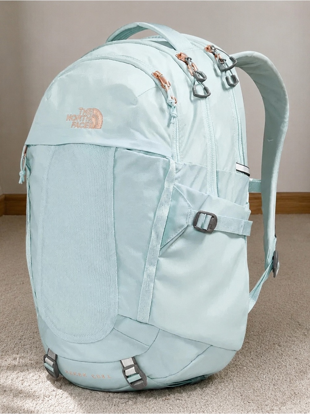 The North Face Light Aqua Backpack with Rose Gold Accents